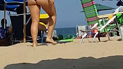 candid shots of this little 18+ slut's ass in a bikini at the beach, hidden from view