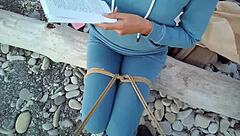 Sofi feels relaxed reading her book by the sea in POV