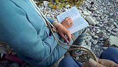 Sofi feels relaxed reading her book by the sea in POV