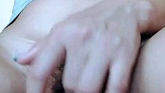 Solo girl fingers her hairy pink pussy until legs shake in orgasm.