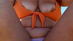 Woman Flashes Tits To Pay At Beach