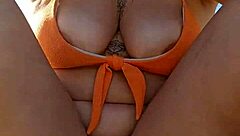 Woman Flashes Tits To Pay At Beach