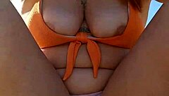 Woman Flashes Tits To Pay At Beach