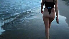 The blonde bares her tits on the beach and makes a blowjob