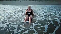 Blonde boldly flashes tits and sucks cock on public beach