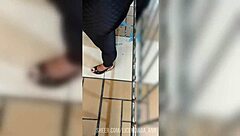 A Mature Woman In Leggings Walking Down The Street In Usa