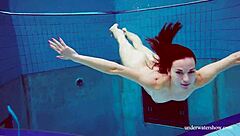 blue bikini hugs martina's tight pussy underwater suggestively