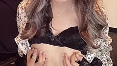 I filmed this beautiful asian ladyboy masturbating quietly in her one-piece dress.