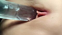 Shaved girl bored, using toys on her hairless pussy in close up fetish play