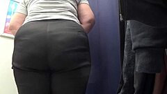 Camera Catches Curvy MILF Changing Clothes in Fitting Room, Revealing Big Ass in Satin Panties