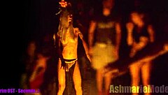 why is this goth slut in bunny costume dancing topless in public cemetery, showing small waist and armpits?