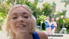 Three gymnasts perform acrobatics outdoors