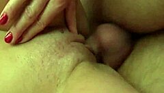 An aged woman interacts with male and female providers