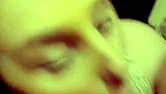 A redhead milf is sucking on a hard cock in a casual setting.