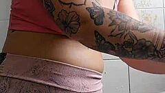 exhibitionist flashes swollen pussy in tight shorts in kitchen