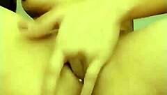 Is She Masturbating While Being Spied On In This Provocative Encounter?