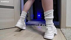 delicate legs in sneakers are waiting for you in the shower