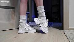 delicate legs in sneakers are waiting for you in the shower