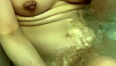 Wife washes body slowly in bath. I want to touch her nipples.