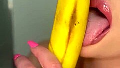 Horny girl sucks banana