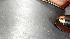 Mature Woman Hides Her Feet in Wedges and Sandals During Candid Moment