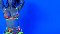 Petite busty milf Joanna Angel slips out of neon lingerie