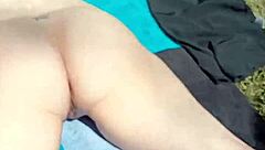 Mature woman spreads her big pussy in nature's secret garden