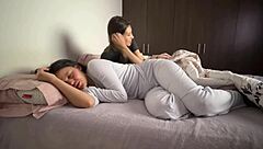 Latina lesbians snuggle in bed, groping asses and masturbating vaginas suggestively