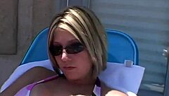 Paige Lotions Up Her Body Outdoors Under The Sunshine Intensely