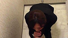 Japanese secretary gives blowjob to boss in public toilet.