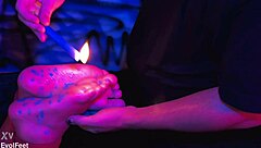 i offer candle wax play on tied feet