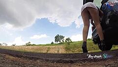 Look at this naughty girl in short skirt no panties opening car trunk on highway Thay Ksada