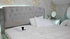 A student with big tits casually undresses on camera after her study session.