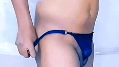 Detailed small cock ebony shemale strips and teases at home with dildo play.