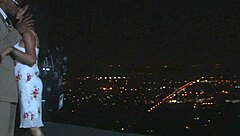 Hey, a mature woman enjoys an outdoor meeting at night