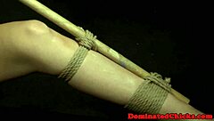 tormented bitch tied up and punished with vibrator in rough garage domination