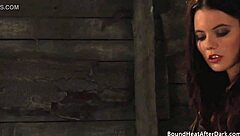 Submissive teen in silk panties faces femdom whipping on bare ass from lesbian mistress in bondage.