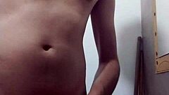 Skinny young amateur undresses for intense solo masturbation in the bathroom