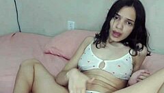 Huge dildo penetrates Brazilian bisexual in close-up fetish play.