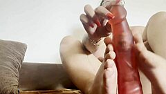 She showcased her big tits while performing a sensual dildo footjob, teasing every curve in the scene