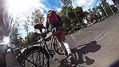 Exhibiting miniskirt upskirt through city streets with pigtails and socks