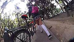 Exhibiting miniskirt upskirt through city streets with pigtails and socks