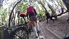 Exhibiting miniskirt upskirt through city streets with pigtails and socks