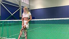 a blonde on a tennis court
