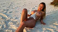 i pose naked as monika fox on the beach sprinkling sand showing everything free