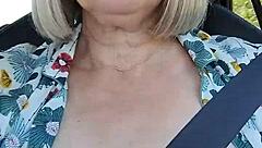 Hey, check out my naughty housewife flashing her tits in this homemade car selfie!