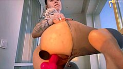 Hey, watch her massive curvy ass drop hard onto that huge dildo in leggings!