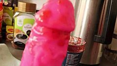 Amateur girl with a strange taste gives an oral pleasure to a big dildo
