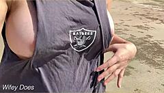 wife enjoys a relaxing walk around the public beach without clothes