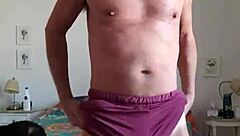 pervy guy trying to stay warm in snow by rubbing his bulge in shorts and thong